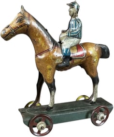 LARGE DISTLER JOCKEY ON HORSE PENNY TOY