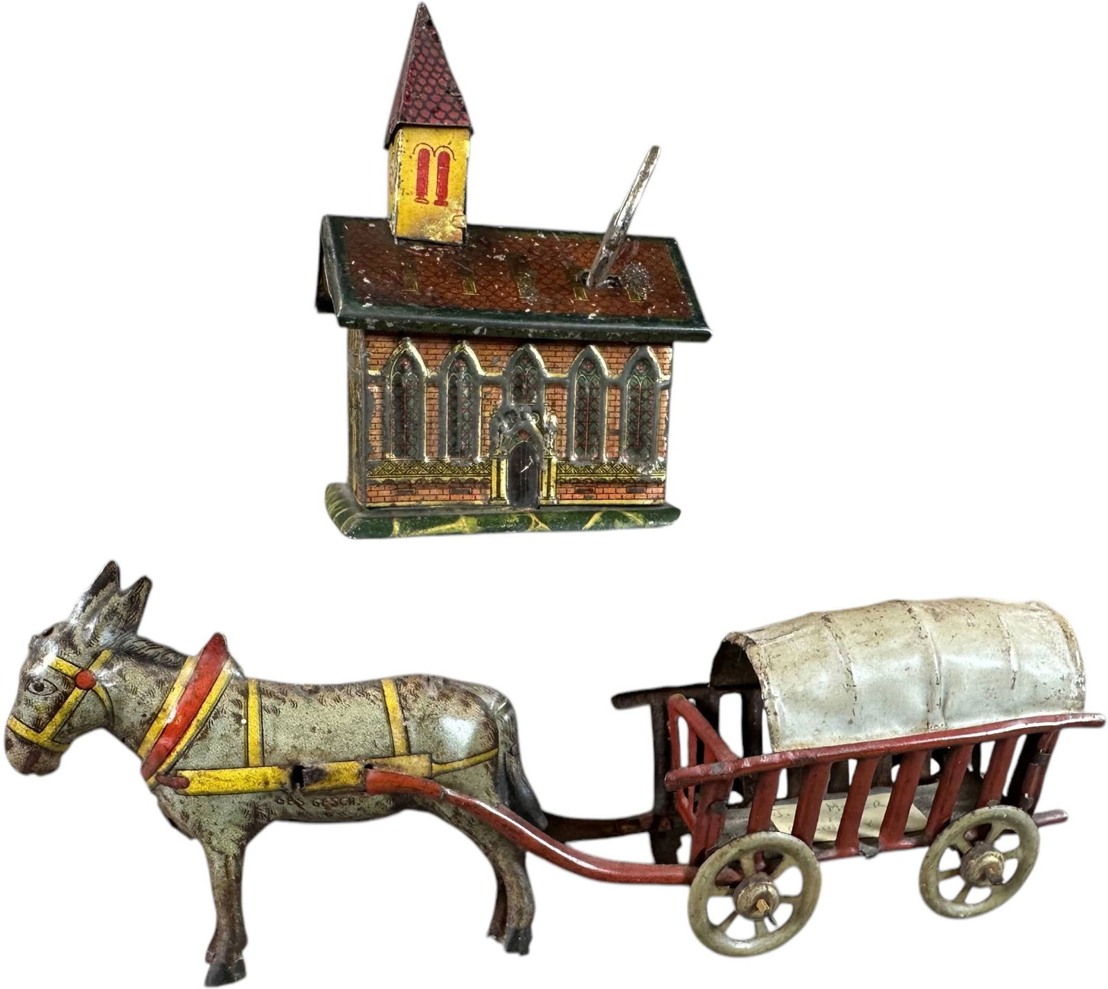 CHURCH BANK W/ DONKEY WAGON PENNY TOYS: 354. CHURCH BANK W/ DONKEY WAGON PENNY TOYS | Donkey cart is made by Meier. | 6.5" l. | (Very Good to Excellent Condition) | $200 - $300