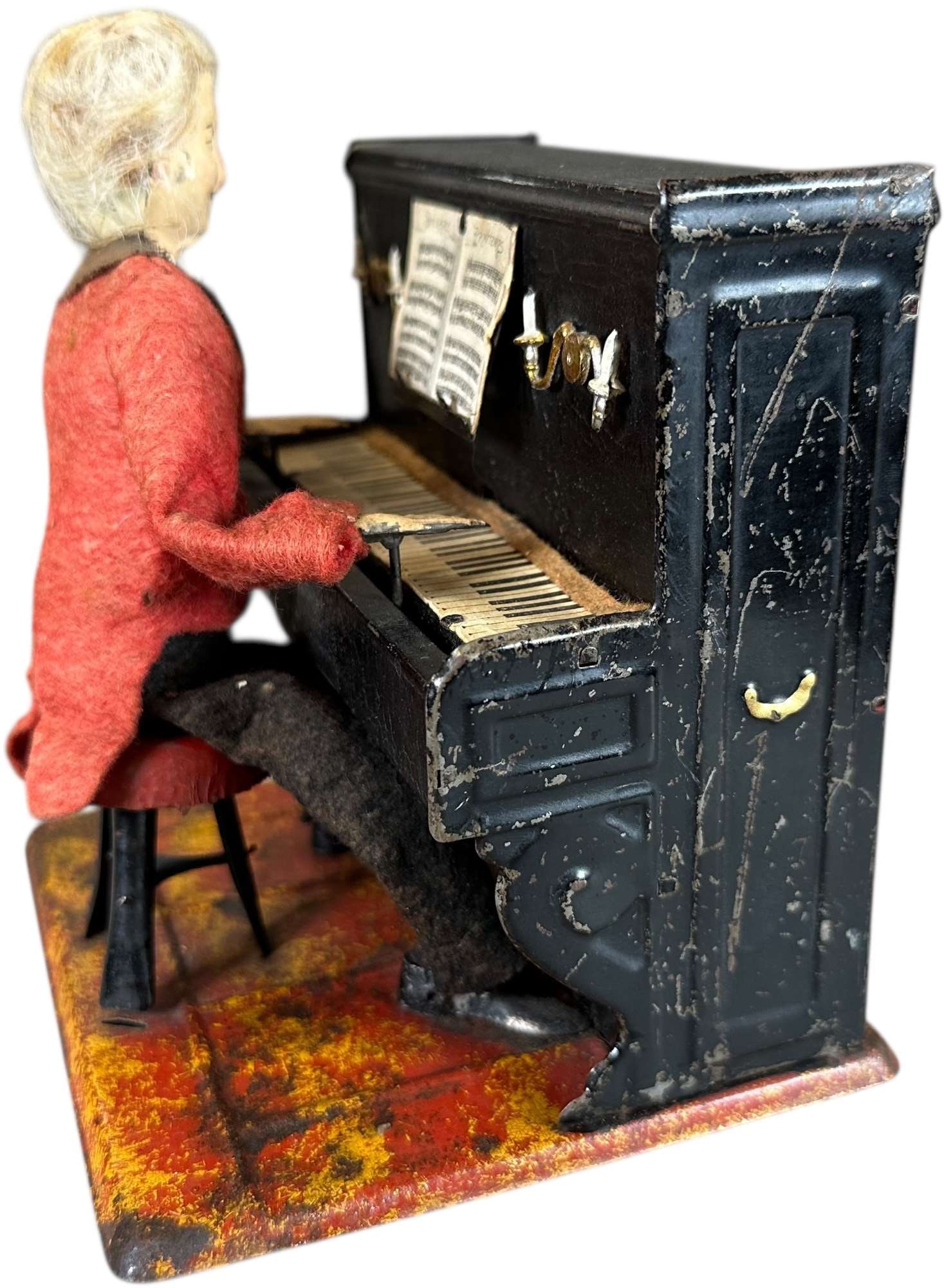 FERNAND MARTIN THE PIANIST: 403. FERNAND MARTIN THE PIANIST | Le Petit Pianiste, circa 1902, the piano actually emits a chime music when wound. | 5" h. | (Excellent Condition) | $600 - $1,000
