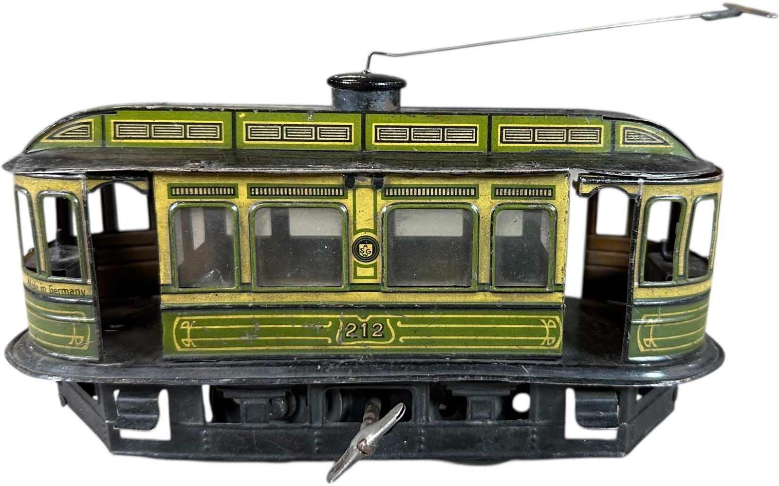 GUNTHERMANN WIND-UP TROLLEY: 66. GUNTHERMANN WIND-UP TROLLEY | Wind-up, litho. | 8.5" l. | Contemporary pole and cap added, otherwise original (Very Good to Excellent Condition) | $150 - $300