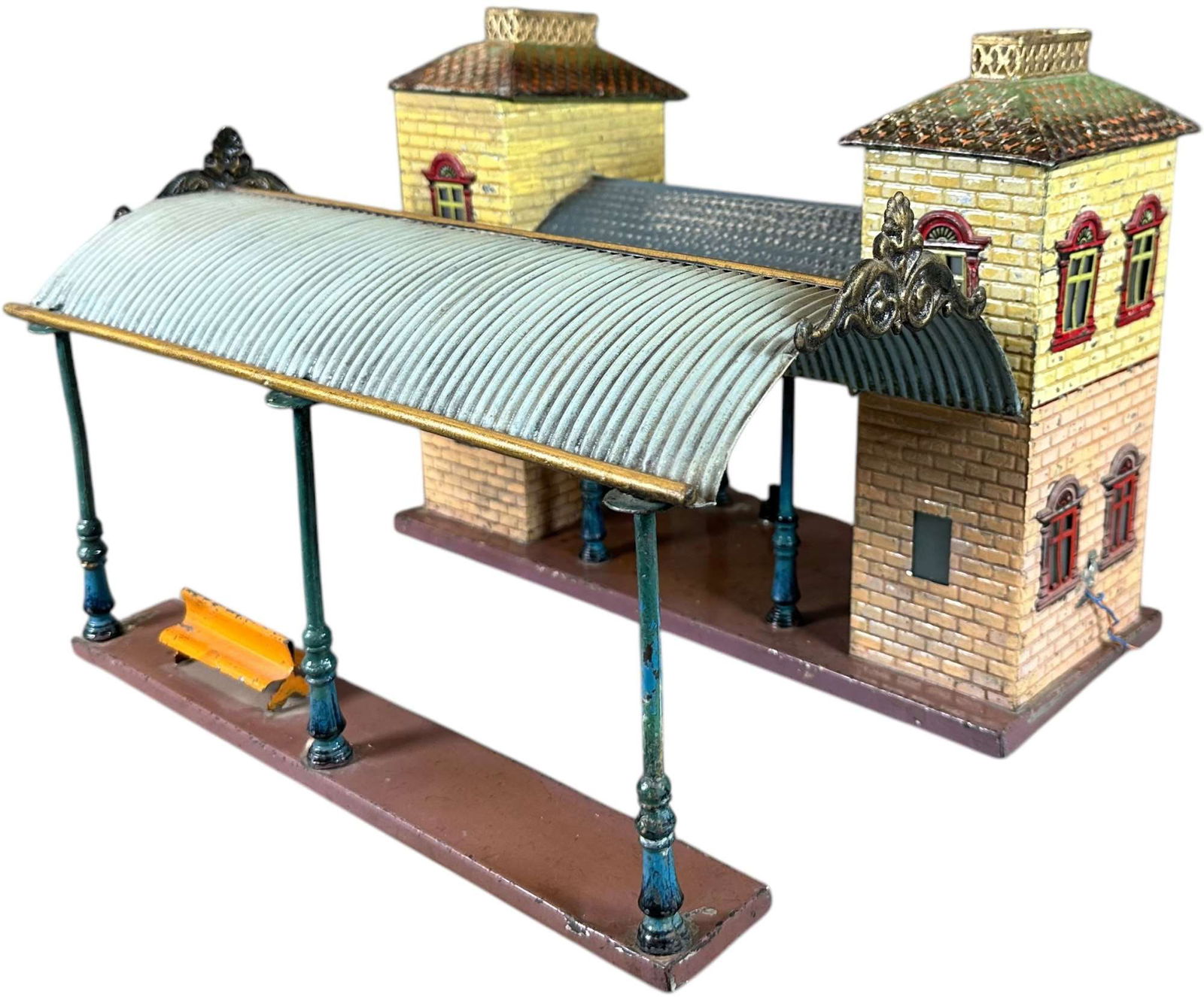 EARLY BING STATION W/ CANOPY: 75. EARLY BING STATION W/ CANOPY | O gauge, hand painted. | 13 x 11.5" l. x w. | Restoration throughout, displays in (Very Good to Excellent Condition) | $300 - $500