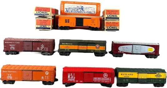 SEVEN BOXED POSTWAR LIONEL BOX CARS