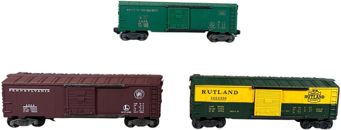 THREE POSTWAR LIONEL BOX CARS