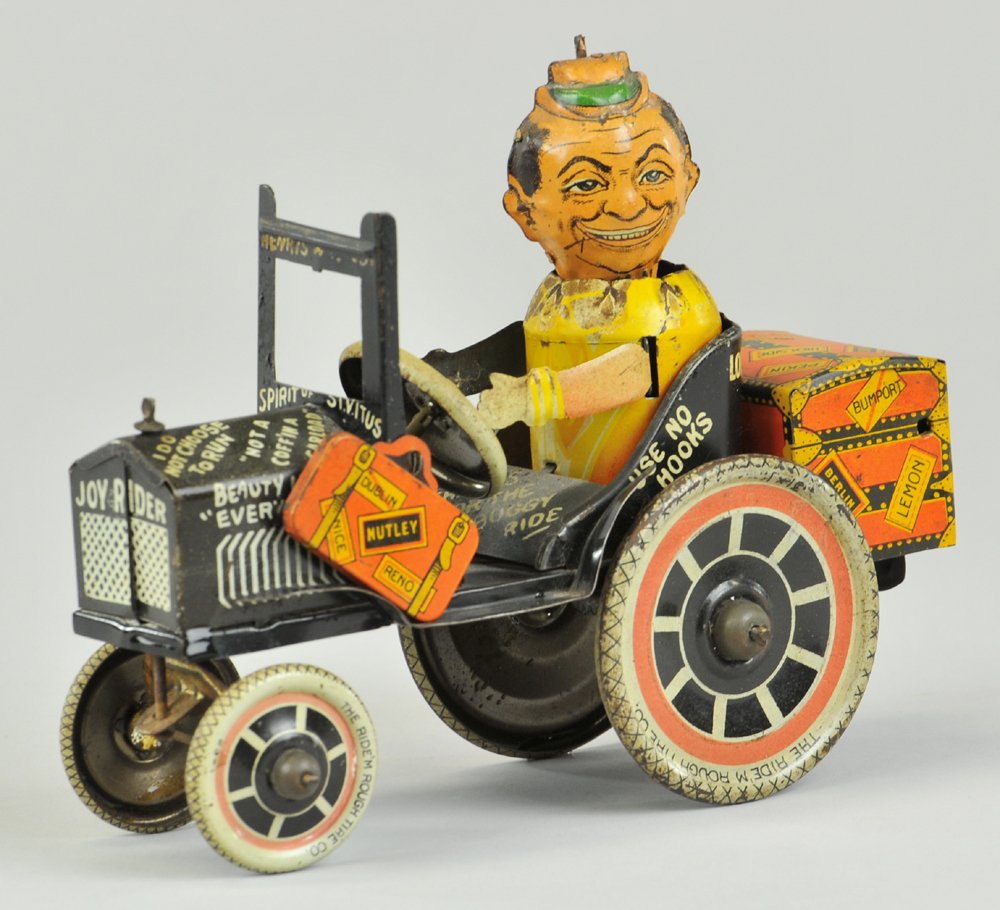 MARX JOY RIDER CAR: Louis Marx, c. 1929, lithographed tin funny car with comical driver and humorous graphics throughout vehicle, clockwork mechanism activates spinning of driver's head. 7 1/2" l.