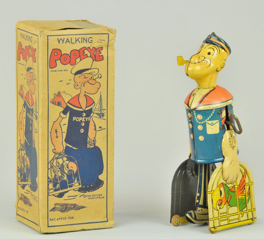 POPEYE CARRYING PARROT CAGES & BOX: Chein, lithographed tin depiction of Popeye walking with two parrot cages, clockwork mechanism activates walking motion, with original tattered box. 8 1/2" h.