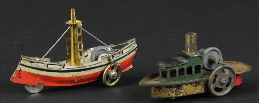 LOT OF TWO BOAT PENNY TOYS: Germany, both lithographed tin, includes tugboat and sail ship, each with flywheels on deck. 3 3/4" to 4 1/4" l.