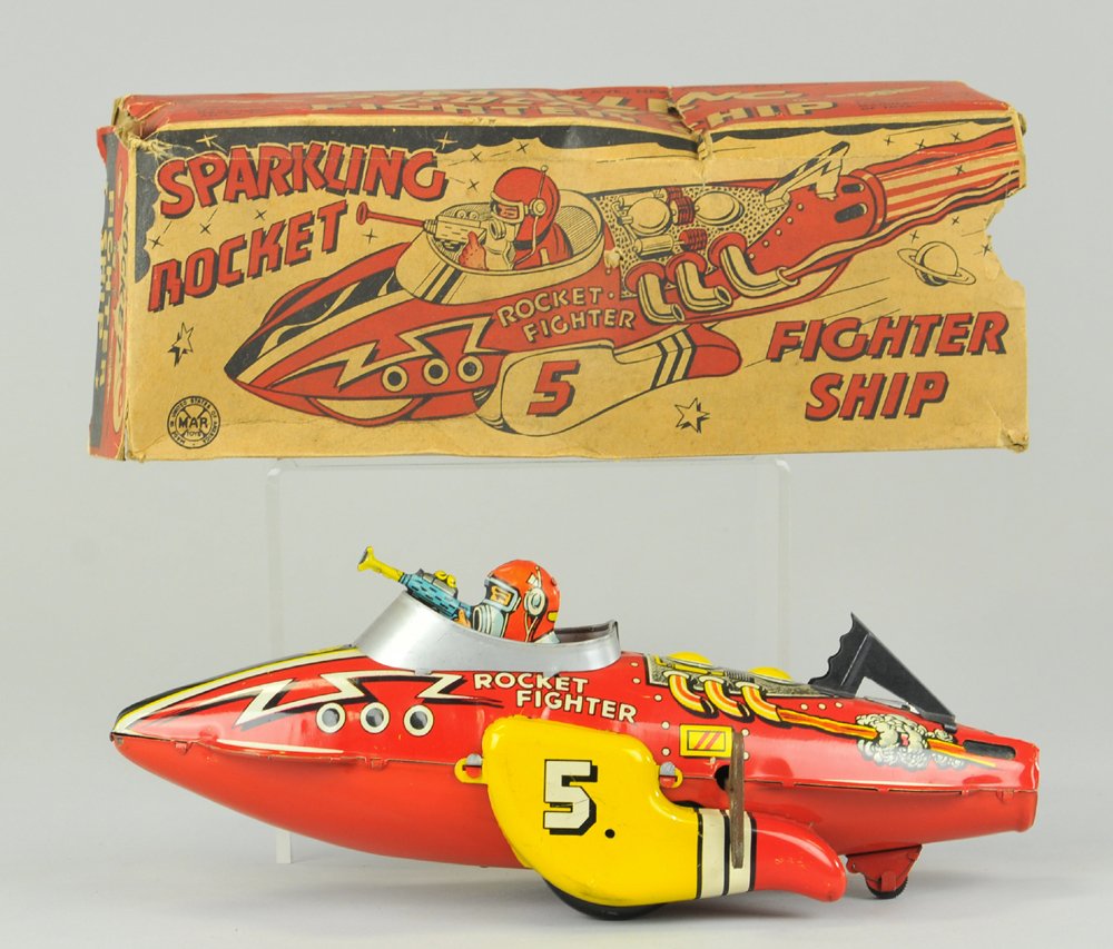 ROCKET FIGHTER WITH BOX: Louis Marx, lithographed tin, colorful space toy with seated pilot holding ray gun in hand, clockwork driven, not working. 12" l.