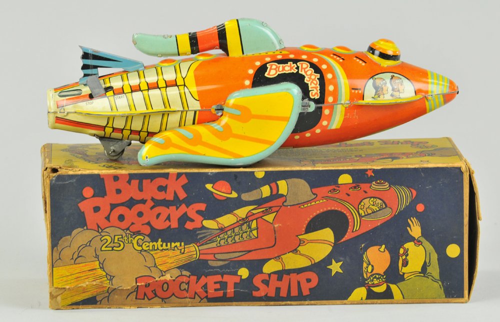 BUCK ROGER'S ROCKET SHIP: Louis Marx, boxed example, lithographed tin, very colorful futuristic space toy with seated figure holding gun in cockpit, clockwork activated. 11 1/2" l.