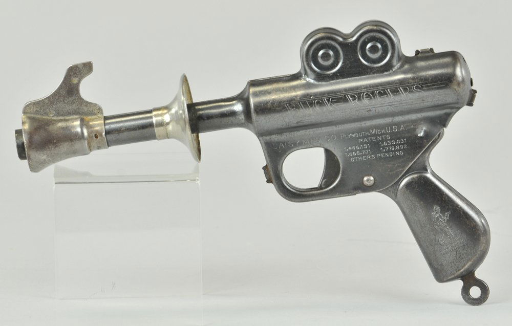 BUCK ROGERS DAISY TOY PISTOL: Pressed steel, gun blue with extensive debossed lettering, futuristic for its day. 9 1/2" l.