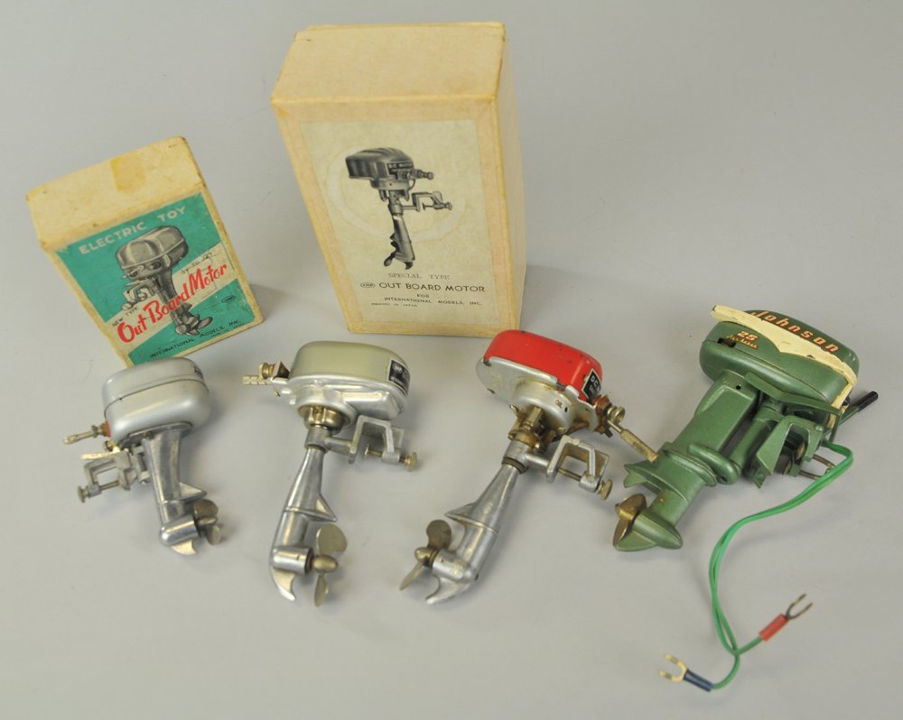GROUPING OF MINIATURE TOY OUTBOARD MOTORS: International Motors, Japan, includes boxed I.M.P. Mercury, I.M.P. D.C. Motor, boxed outboard motor and Johnson Sea Horse 25. 3 3/4" to 5 1/2".