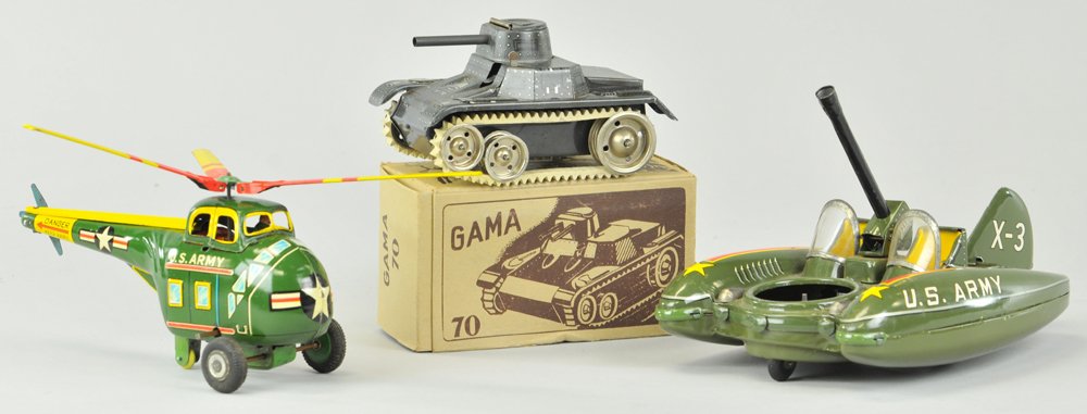 GROUPING OF MILITARY TOYS: Includes boxed game tank done in grey litho and clockwork drive, together with U.S. Army tank with internal props and Helicopter with clockwork motor. 5 1/2" to 8" lamp.