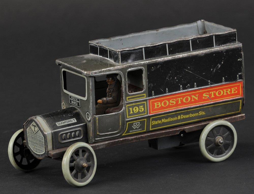 BING "BOSTON STORE" DELIVERY VAN: Germany, c. 1920's, made as private label toy truck for the American market, enclosed van delivery truck with store ad and location on side of body, seated driver, opening rear doors, key wind driven.