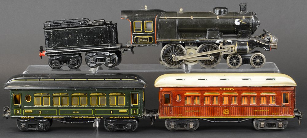 MARKLIN '1' GAUGE TRAIN SET: Germany, includes 4-4-0 black painted electric locomotive and tender, together with "Mitropa" dining car and passenger car in green, both roofs lift to reveal interior settings. Locomotive 20 1/2" l. 