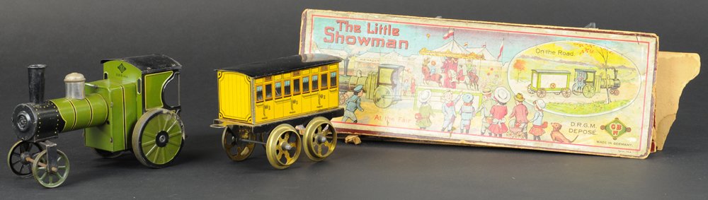 BING "LITTLE SNOWMAN" TRAIN SET: Germany, includes partial box, great graphics on box lid, lithographed floor locomotive done in green, coach has extensive window graphic details, loco is clockwork driven. 13" overall length.