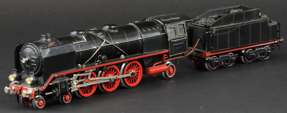 MARKLIN 4-6-2 'O' GAUGE ELECTRIC LOCOMOTIVE: Germany, No. 66/12920, black boiler, red wheels, nickel railing, eight wheel tender has embossed coal load, nice detail overall. 21" Overall length.
