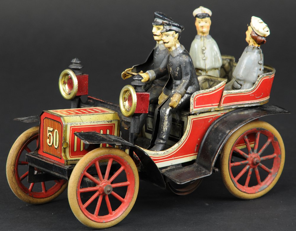 CARETTE NO. 50 TONNEAU: Germany, c. 1906, lithographed tin, classic tourer with four seats, large lamps and full curved fenders, rubber tires, spoke wheels, clockwork driven, No. 50 appears on grille and rear body, figures a
