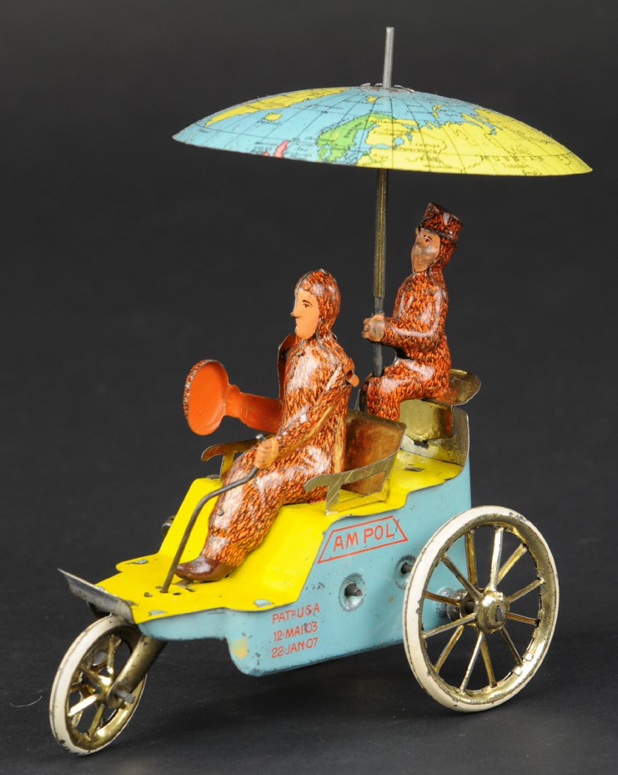 LEHMANN AM POL: Germany, lithographed and hand-painted tin, dark blue sides, red spokes, depiction of Explorer Robert E. Peary dressed in fur coat, as is his companion, Hensley, seated on rear seat holding umbrella w