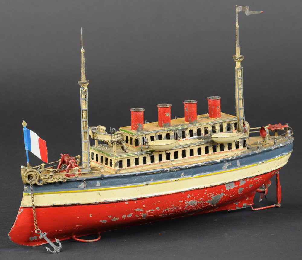 CARETTE OCEAN LINER: Germany, hand painted tin, done in classic red, white, and blue colors, contains four lifeboats, two ventilators, four funnels, two masts, and two-level passenger cabin, pilot's deck, and clockwork dr