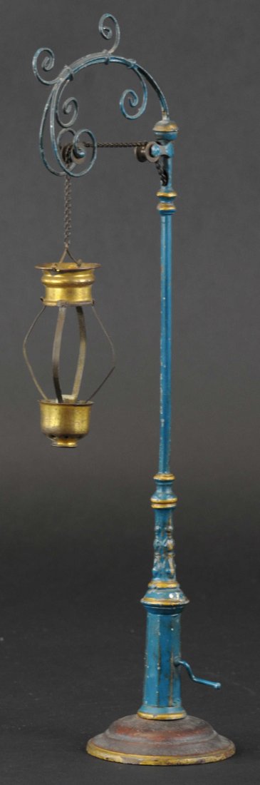 MARKLIN ARC LAMP: Germany, well detailed cast street lamp with globe frame, chain support able to crank globe up and down for candle light, hand painted overall. 15 1/2" h.