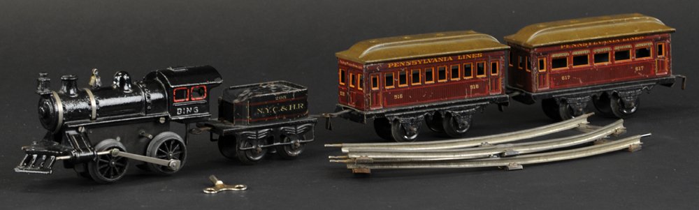 BING PENNSYLVANIA LINE TRAIN SET: Germany, includes an 0-4-0 clockwork cast iron locomotive with tin NYC & HR tender, together with No. 617 passenger and No. 516 Pennsylvania lithographed tin coaches. 22" overall length.