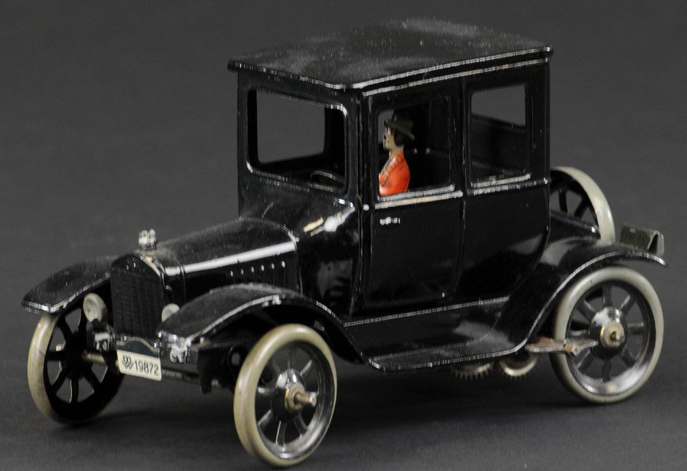 MODEL 'T' FORD ROADSTER: Bing, Germany, lithographed tin, done in black overall, features male driver, spare on trunk, clockwork driven. 6 1/4" l.