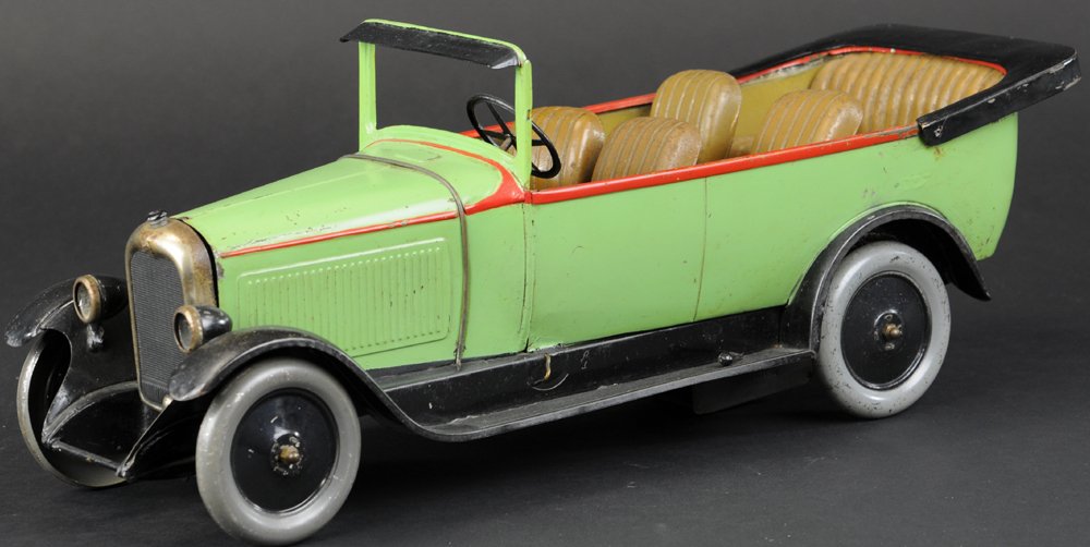 CITROEN C4 HIRE CAR: France, large scale open vehicle is clockwork driven, interior features foldable seating, simulated fold-down top, body paint in green overall, red striping, metal wheels, nickel grille. 17" l.