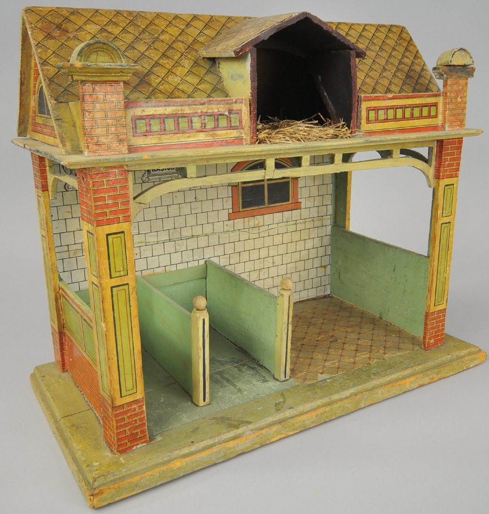 GERMAN STABLE: This two stall stable includes open space for storage of equipment, also has hay loft under roof, lithography and paint is all intact and in good condition for age. 15 1/2" h. x 19" w.