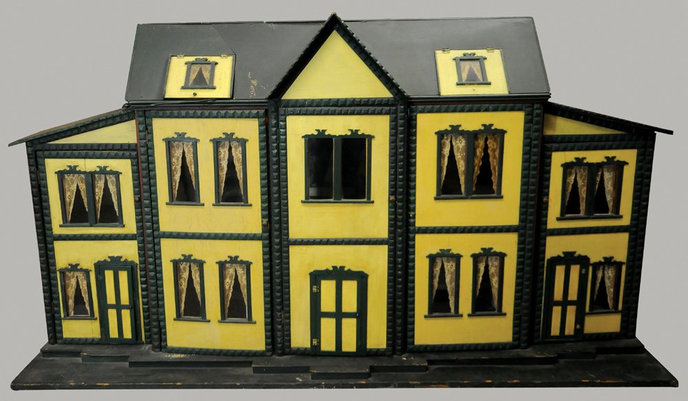 MYSTERY DOLLHOUSE: Late 19th century dollhouse with ten main rooms, two attic rooms w/inter-connecting doors, painted a soft yellow w/chamfered wood green trim, original door opening were replaced by wooden knobs instea