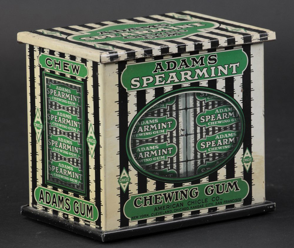 ADAMS GUM COUNTER TOP DISPLAY: Tin litho counter top display for Adams Spearmint Chewing gum, nice graphics on all sides, top lifts for gum retrieval. 6 1/4" h.