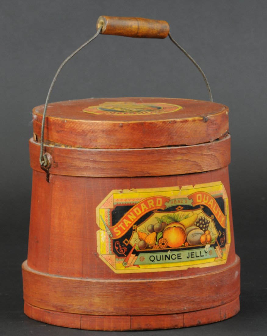 BALE HANDLE FIRKIN, HEINZ QUINCE JELLY BUCKET: Paper litho label, wood Firkin for Heinz's Quince Jelly with partial label on lid, a hard to find piece with all of the labels. 8" h.