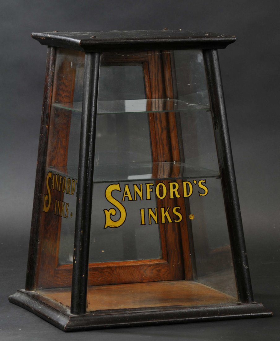 SANFORD'S INK DISPLAY: Case has angled front, pyramid shaped oak with glass panel and stenciled front, appealing design. 16" h.