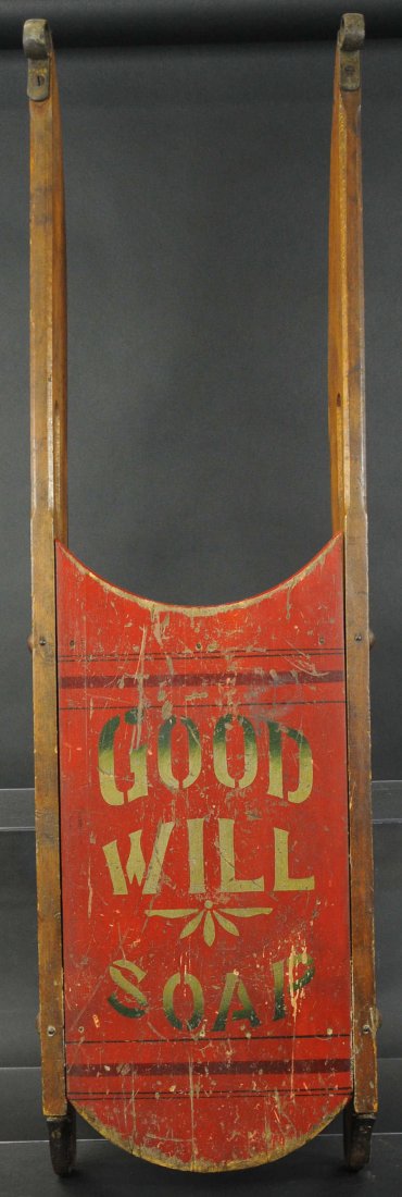 GOOD WILL SOAP CHILD'S SLED: Early child's wooden sled advertising "Good Will Soap," wood runners with metal gliders, lettering done in gold, red seat. 37"