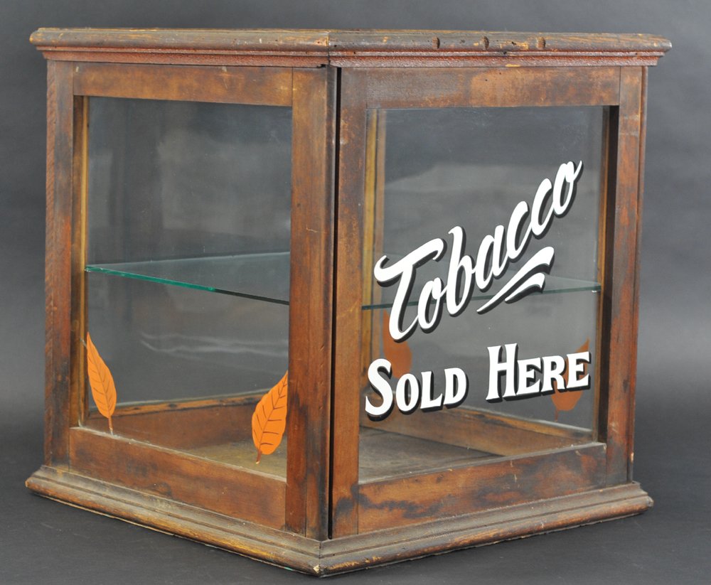 FOUR SQUARE OAK & GLASS DISPLAY CASE: Recent lettering on the front reads "Tobacco Sold Here," five tobacco knots included, most likely was a country store cheese display case. 22" h.