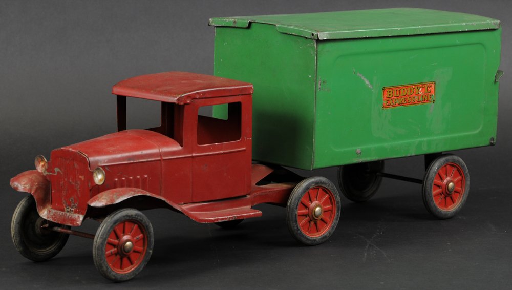 BUDDY 'L' EXPRESS LINE TRUCK: c. 1933, pressed steel, red enclosed cab, green box van body with removable roof, fold-down tailgate, embossed rubber wheels. 23 3/4" l.