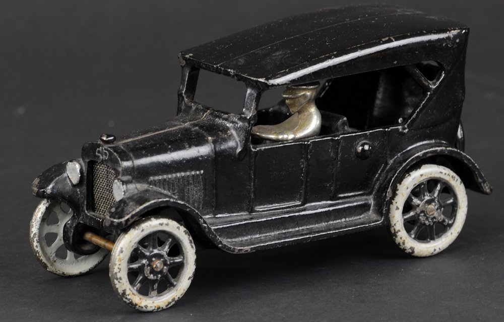 ARCADE MODEL 'T' TOURING CAR: Cast iron, done in black w/cast canopy roof, silver spoke wheels. 6" l.