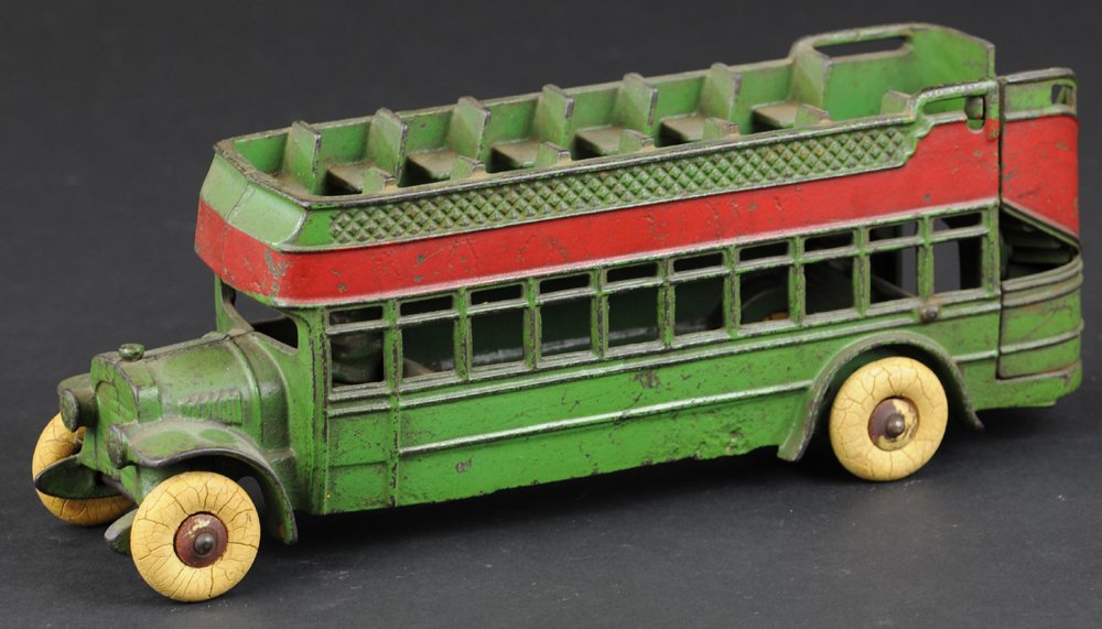 KENTON CITY BUS: c. 1930's, cast iron, painted in green overall, red side stripe, cast upper deck seating, rubber tires. 11 1/2" l.
