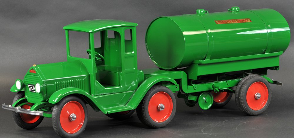 STURDITOY TRACTOR & TRAILER OIL TANKER: c. 1930, enclosed doorless cab painted in rare green, nickel plated bumper, pulls tank body trailer with retractable landing gear, also painted in rare green filler caps on top, two rear faucets, full