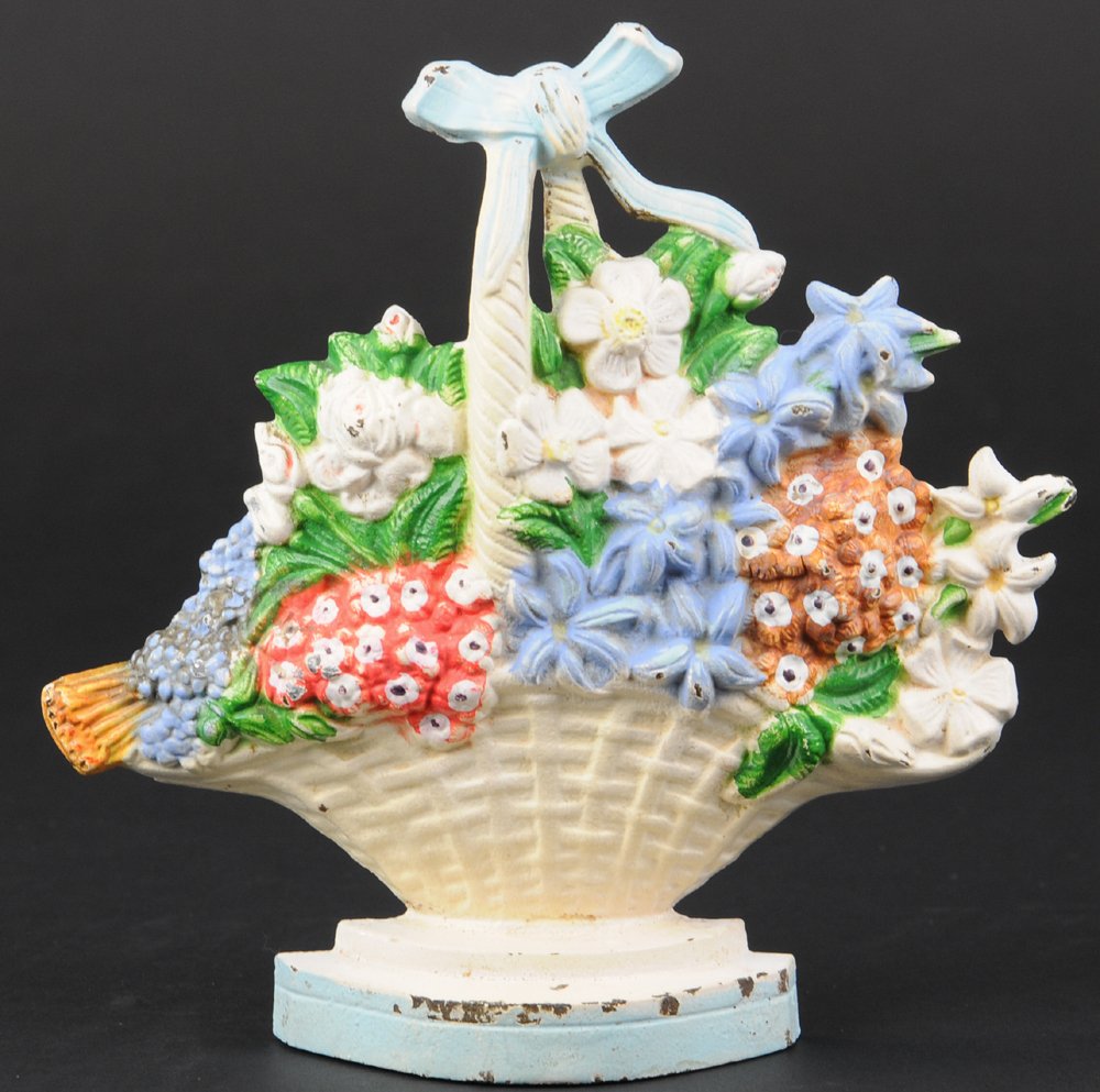 WILD ROSES DOORSTOP: Hubley "475," beautiful arrangement of mixed flowers & greens in woven basket w/blue bow. 7 1/2" h.