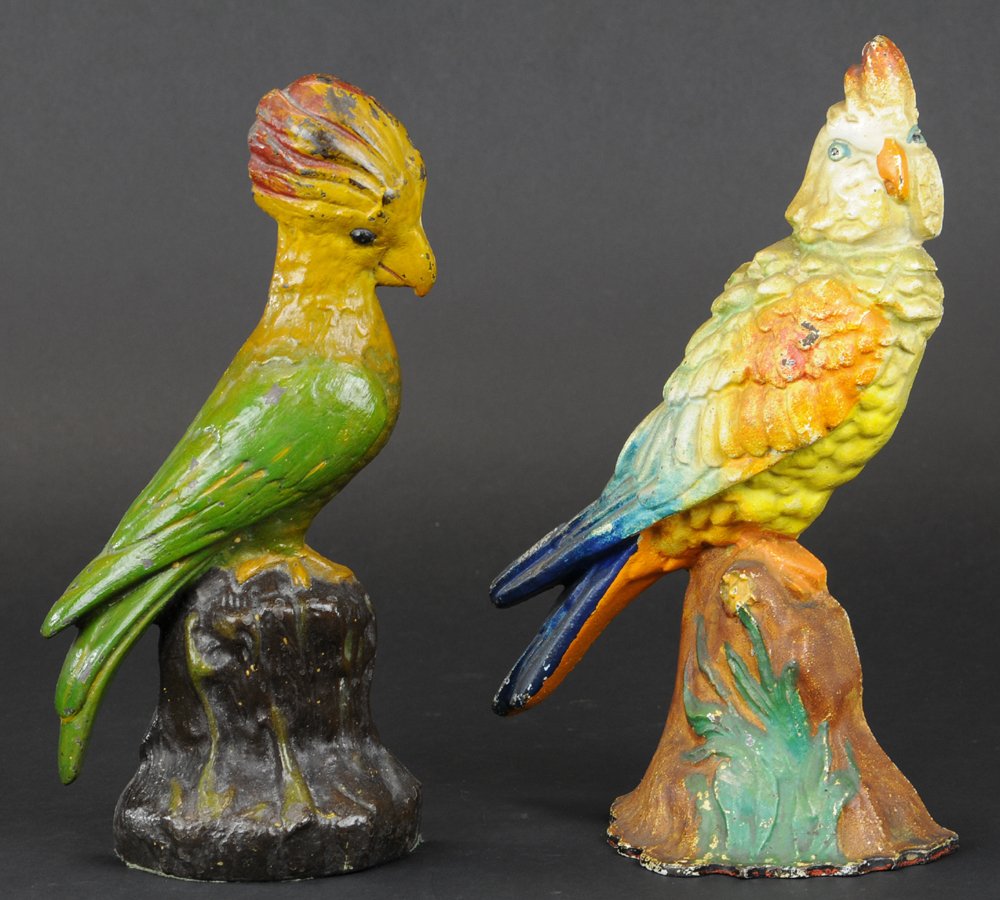 PARROT & COCKATOO ON STUMP DOORSTOPS: Two beautiful & colorful birds on stump doorstops, one parrot, the other cockatoo, both have nice size & form. 11 1/2" h.