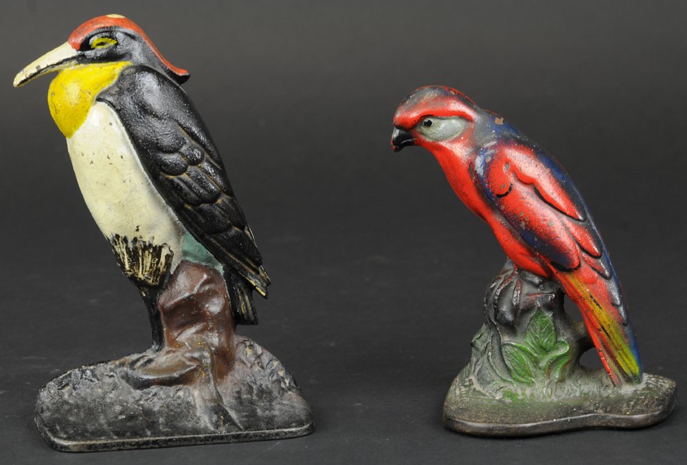 HERON & SMALL RED BIRD DOORSTOPS: Colorful casting and great depiction of this wetland Heron bird, also a red bird sitting on stump w/green foliage. 6" to 8" h.