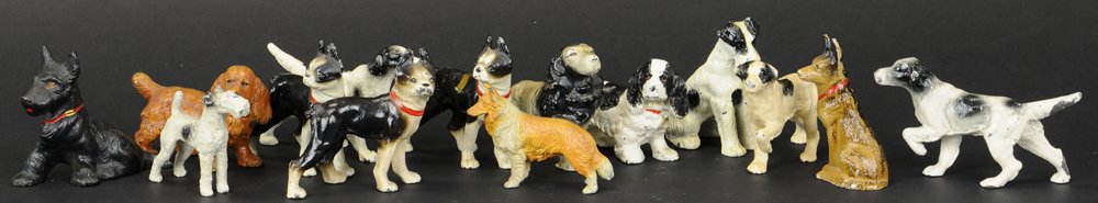 LOT OF HUBLEY DOG PAPERWEIGHTS: Fourteen dogs which include: Setters, Pointers, German Shepard, Terriers, Scottie, and Spaniels; all in varied colors & poses, souvenir pieces. 2" to 3" h.