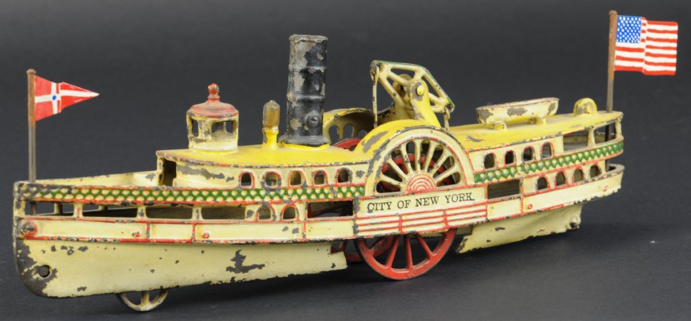WILKENS "CITY OF NEW YORK" PADDLE WHEELER: Cast iron, painted in white, red trim, yellow deck, lifeboat and stack cast on board, well detailed floor toy model. 15" l.
