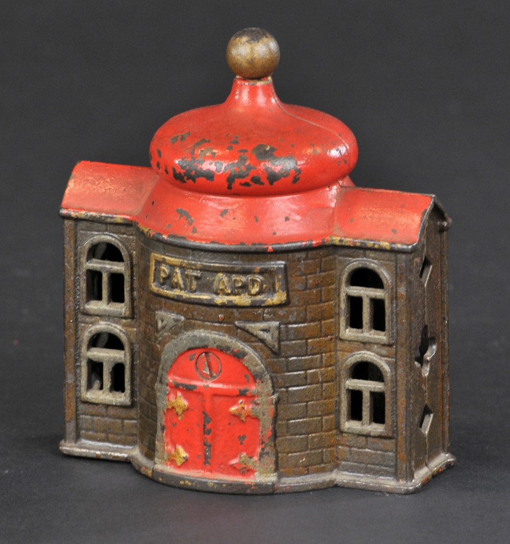 PRESTO MECHANICAL BANK: Kyser & Rex, cast iron, japanned finish with red roof and door, tray opens when lever is depressed, embossing on front. 4 1/2" h.
