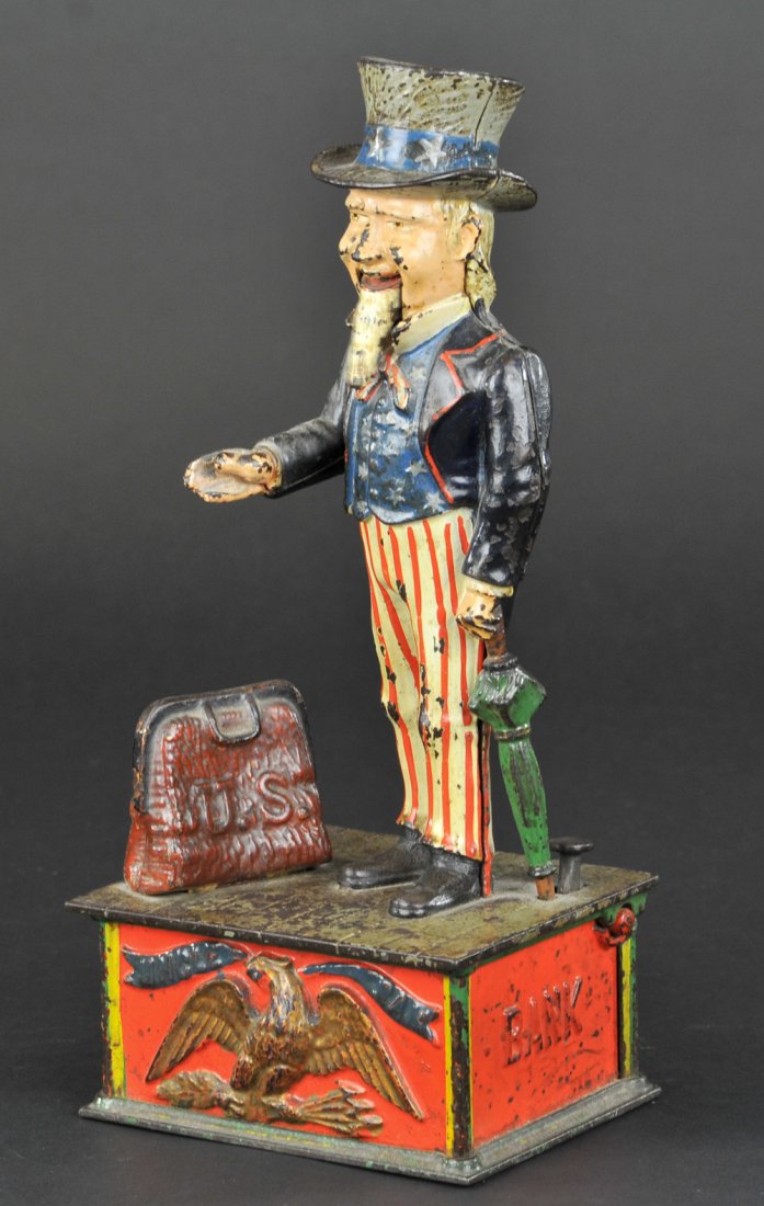 UNCLE SAM MECHANICAL BANK: Shepard Hardware Co., designed by Charles Shepard & Peter Adams, patented 6/8/1886. A very comical appearance is given to the face when the lower jaw being balanced on pivots is easily kept in motion.