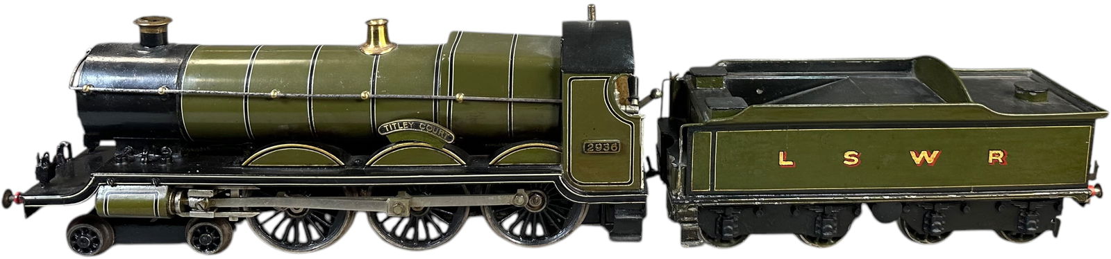 BING LSWR 4-6-0 LOCOMOTIVE: 15. BING LSWR 4-6-0 LOCOMOTIVE | Gauge 1, live steam, hand painted. Ex: The Tony Cuff UK Collection. | 14" l. loco | Some in-filling to chips in tender, (Very Good to Excellent Condition) | $1,500 - $