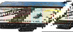 SCARCE MARKLIN BUDWEISER BOX CAR: 52. SCARCE MARKLIN BUDWEISER BOX CAR | O gauge, circa 1904, beautifully hand painted with Budweiser logos and advertising. | 8" l. | Ultra rare in this size, the roof shows the most wear while the sid