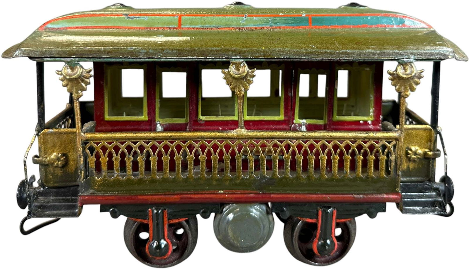 MARKLIN VERANDA CAR: 59. MARKLIN VERANDA CAR | Gauge 1, beautifully hand painted veranda car with cast iron wheels and early loop couplers. | 7.5" l. | Nice patina crazing to original paint, (Very Good to Excellent Condit