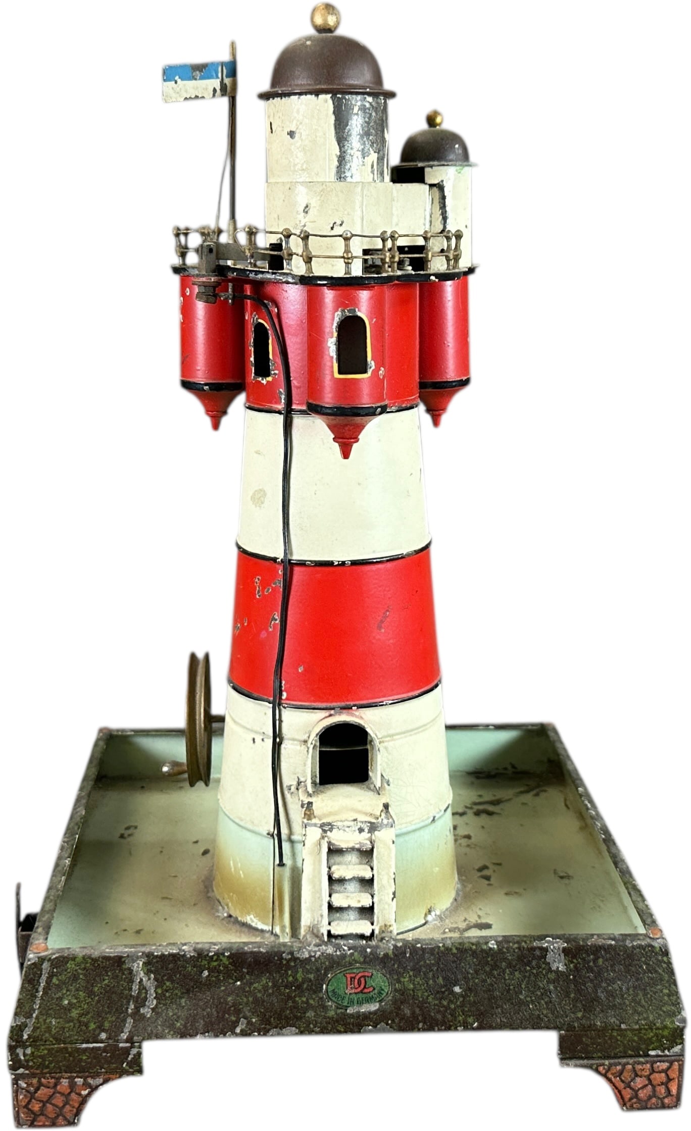 DOLL CO ELECTRIC LIGHTHOUSE TOY: 126. DOLL CO ELECTRIC LIGHTHOUSE TOY | 13.5 " h. | All original paint with the tower resoldered at the base, under black light UV the top dome appears to be replaced, overall (Excellent Condition) | $