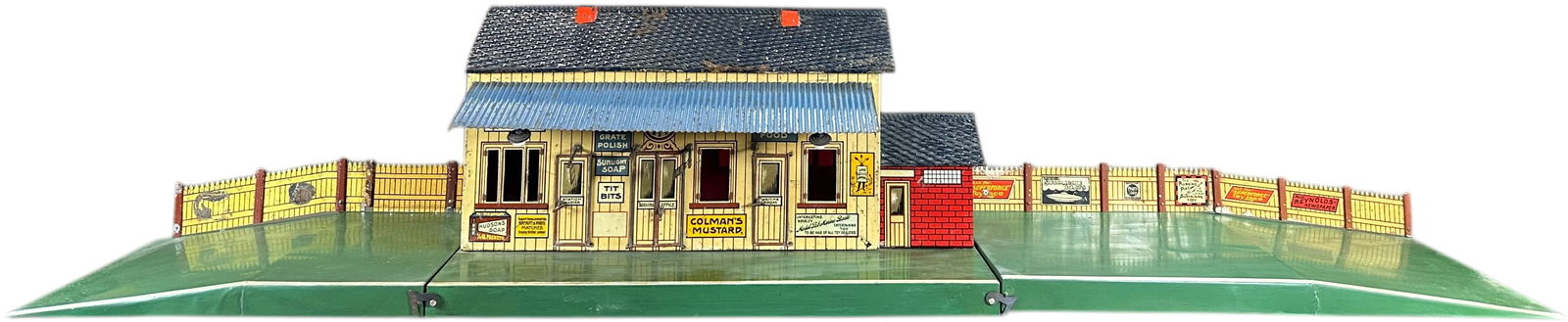 RARE BING ENGLISH NUT AND BOLT STATION: 146. RARE BING ENGLISH NUT AND BOLT STATION | Gauge 1 and 2, litho, rare station with nut and bolt construction that disassembles into flat pieces. Ex: The Tony Cuff UK Collection. | 40 x 9.5 base | O