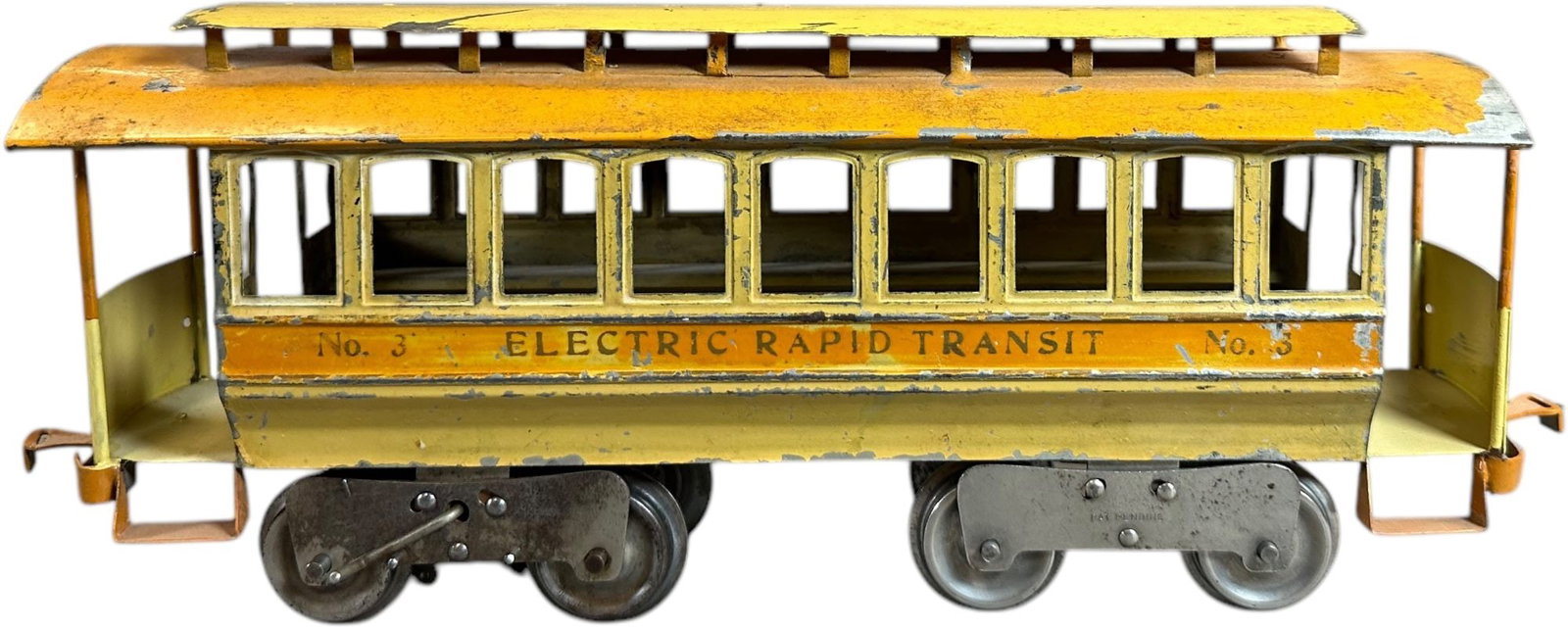 EARLY LIONEL NO.3 TROLLEY: 217. EARLY LIONEL NO.3 TROLLEY | Standard gauge, electric, reverse switch on powered truck. Provenance: Bradley Kaplan Collection. | 14.5" l. | Platform ends are replaced, roof expertly repainted and 